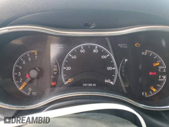 2014 Jeep Grand Cherokee Laredo with VIN 1C4RJEAGXEC573989, listed as a Copart auction lot 67977075 with 141,134 mi miles and Salvage title. Bid and sale history available at DreamBid. Image 9.