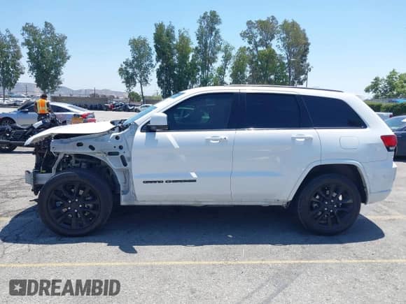 2020 Jeep Grand Cherokee Laredo E with VIN 1C4RJEAG1LC170576, listed as a IAAI auction lot 42283104 with 123,068 mi miles and . Bid and sale history available at DreamBid. Image 15.