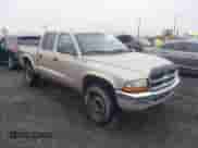2004 Dodge Dakota SLT with VIN 1D7HG48NX4S596370, listed as a IAAI auction lot 41760565 with 232,409 mi miles and . Bid and sale history available at DreamBid. Image 1.
