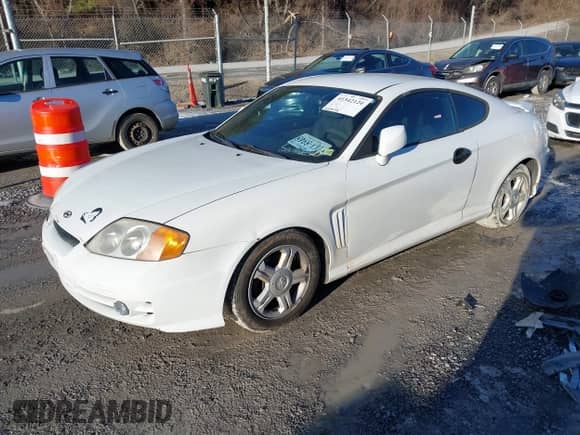 2004 Hyundai Tiburon GS with VIN KMHHM65D94U105300, listed as a IAAI auction lot 41342124 with 229,938 mi miles and . Bid and sale history available at DreamBid. Image 17.