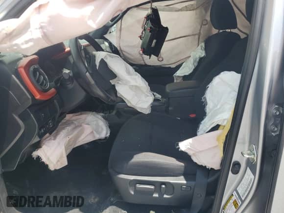 2020 Toyota Tacoma SR5 с VIN 5TFAZ5CN1LX090978, выставлен на аукционе Copart как лот 64010265 с пробегом 117 433 миль миль и Списание • Salvage title. История ставок и продаж доступна на DreamBid. Изображение 7.