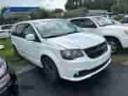 2014 Dodge Grand Caravan SXT with VIN 2C4RDGCG6ER412434, listed as a Copart auction lot 86316495 with 144,803 mi miles and Clean title. Bid and sale history available at DreamBid. Image 1.