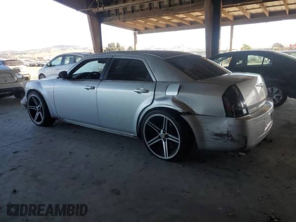 2007 Chrysler 300 with VIN 2C3KA43R37H785728, listed as a Copart auction lot 82369005 with 140,326 mi miles and Salvage title. Bid and sale history available at DreamBid. Image 2.