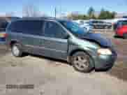 2004 Dodge Caravan SE with VIN 1D4GP24R04B520727, listed as a Copart auction lot 52002475 with 164,954 mi miles and Salvage title. Bid and sale history available at DreamBid. Image 4.