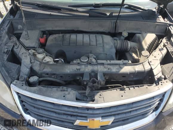 2015 Chevrolet Traverse LS z VIN 1GNKRFEDXFJ206451, wystawiony jako Copart lot #81654145 z przebiegiem 189 680 mil mil oraz Szkoda całkowita • Salvage title. Historia ofert i sprzedaży dostępna na DreamBid. Obrazek 12.