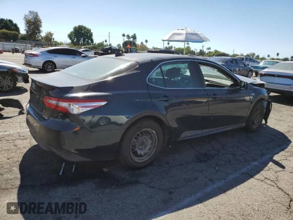 2019 Toyota Camry Hybrid LE с VIN 4T1B31HK2KU517027, выставлен на аукционе Copart как лот 85885055 с пробегом 84 432 миль миль и Списание • Salvage title. История ставок и продаж доступна на DreamBid. Изображение 3.