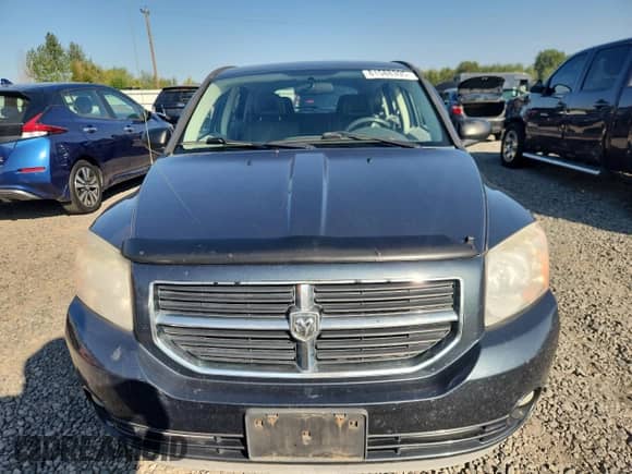 2007 Dodge Caliber SXT with VIN 1B3HB48B77D592513, listed as a Copart auction lot 81588395 with 194,376 mi miles and Salvage title. Bid and sale history available at DreamBid. Image 5.