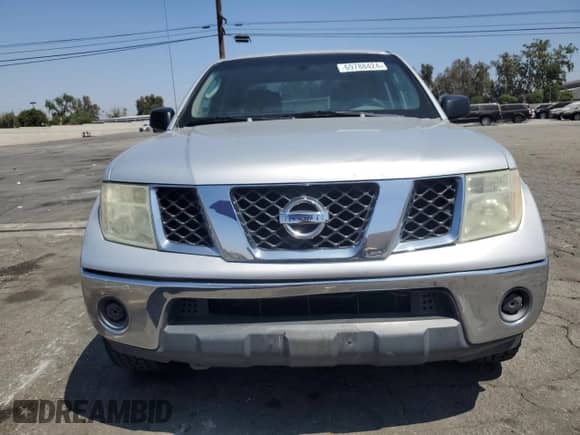 2007 Nissan Frontier SE z VIN 1N6AD09U87C423526, wystawiony jako Copart lot #69788424 z przebiegiem 209 736 mil mil oraz Szkoda całkowita • Salvage title. Historia ofert i sprzedaży dostępna na DreamBid. Obrazek 5.