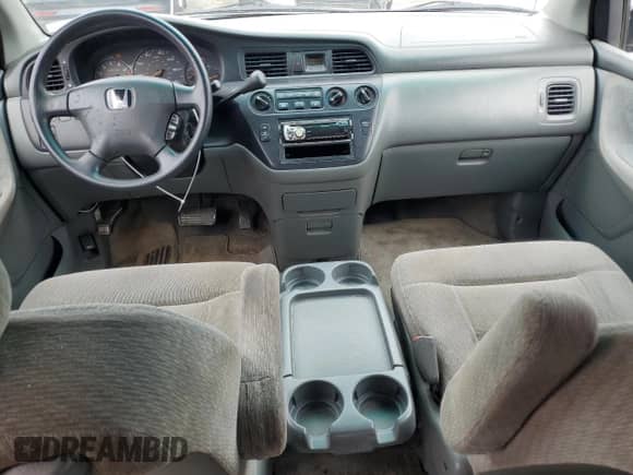 2004 Honda Odyssey LX with VIN 5FNRL18574B075564, listed as a Copart auction lot 67786545 with 214,574 mi miles and Salvage title. Bid and sale history available at DreamBid. Image 8.