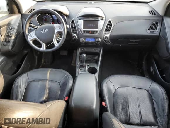 2010 Hyundai Tucson GLS with VIN KM8JUCAC4AU111000, listed as a Copart auction lot 71974685 with 211,510 mi miles and Salvage title. Bid and sale history available at DreamBid. Image 8.