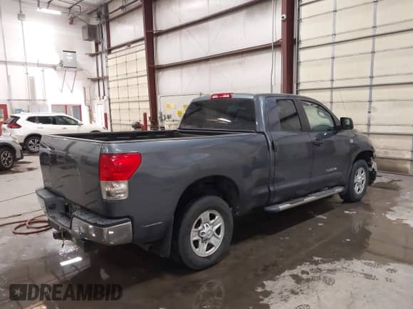 2008 Toyota Tundra z VIN 5TFRT54198X023567, wystawiony jako IAAI lot #43289726 z przebiegiem 185 308 mil mil oraz . Historia ofert i sprzedaży dostępna na DreamBid. Obrazek 4.