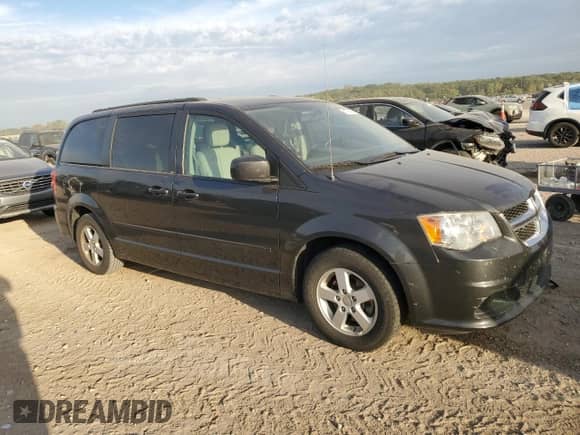 2012 Dodge Grand Caravan SXT with VIN 2C4RDGCG5CR167607, listed as a Copart auction lot 81718455 with 77,349 mi miles and Salvage title. Bid and sale history available at DreamBid. Image 4.