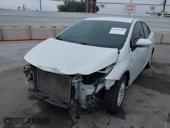 2021 Toyota Prius XLE with VIN JTDKAMFP6M3194992, listed as a IAAI auction lot 43311948 with 96,751 mi miles and . Bid and sale history available at DreamBid. Image 6.