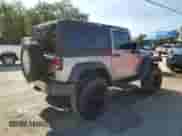 2014 Jeep Wrangler Sport with VIN 1C4AJWAG0EL126249, listed as a Copart auction lot 57768575 with 136,981 mi miles and Salvage title. Bid and sale history available at DreamBid. Image 3.