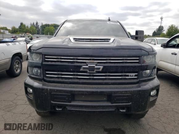 2017 Chevrolet Silverado 2500HD LTZ with VIN 1GC1KWEY7HF240638, listed as a Copart auction lot 80173265 with 153,999 mi miles and Salvage title. Bid and sale history available at DreamBid. Image 5.