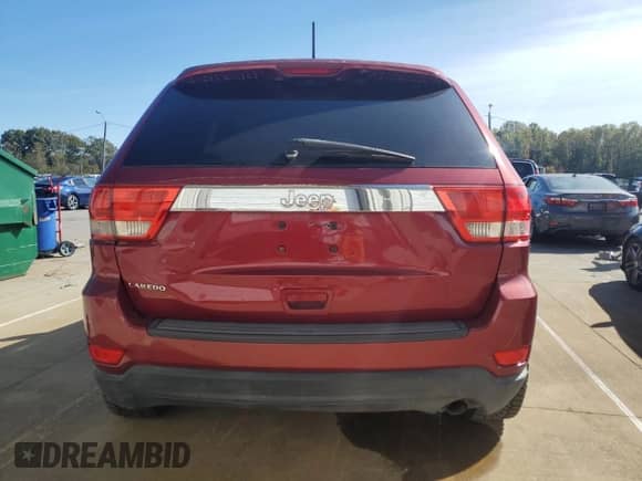 2012 Jeep Grand Cherokee Laredo z VIN 1C4RJEAG4CC223237, wystawiony jako Copart lot #90089515 z przebiegiem 130 232 mil mil oraz Czysty tytuł • Clean title. Historia ofert i sprzedaży dostępna na DreamBid. Obrazek 6.