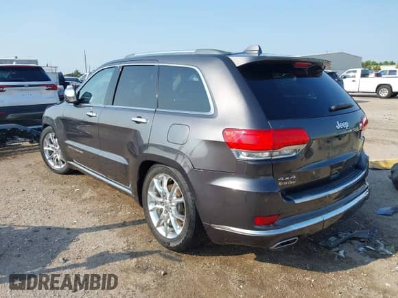2015 Jeep Grand Cherokee Summit with VIN 1C4RJFJTXFC624797, listed as a IAAI auction lot 43244683 with 84,681 mi miles and . Bid and sale history available at DreamBid. Image 3.