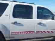 2010 Chevrolet Suburban LT z VIN 1GNUCJE04AR145330, wystawiony jako IAAI lot #42579675 z przebiegiem 185 242 mil mil oraz . Historia ofert i sprzedaży dostępna na DreamBid. Obrazek 13.