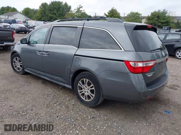 2012 Honda Odyssey EX z VIN 5FNRL5H40CB083650, wystawiony jako IAAI lot #43283741 z przebiegiem 164 693 mil mil oraz . Historia ofert i sprzedaży dostępna na DreamBid. Obrazek 3.