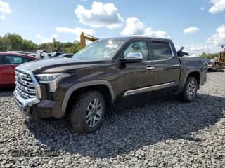2025 Toyota Tundra 1794 Edition with VIN 5TFMA5DB5SX271783, listed as a Copart auction lot 71802655 with 11,800 mi miles and Salvage title. Bid and sale history available at DreamBid. Image 1.