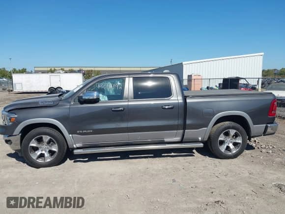 2020 Ram 1500 Laramie with VIN 1C6SRFRT7LN344695, listed as a IAAI auction lot 43316492 with 57,326 mi miles and . Bid and sale history available at DreamBid. Image 14.