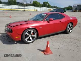 2012 Dodge Challenger SRT-8 392 с VIN 2C3CDYCJ6CH106266, выставлен на аукционе Copart как лот 66922035 с пробегом 58 000 миль миль и Списание • Salvage title. История ставок и продаж доступна на DreamBid. Изображение 1.