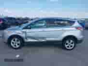 2014 Ford Escape SE z VIN 1FMCU0GX5EUA21457, wystawiony jako IAAI lot #43370908 z przebiegiem 143 709 mil mil oraz . Historia ofert i sprzedaży dostępna na DreamBid. Obrazek 14.