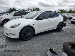2021 Tesla Model Y Performance with VIN 5YJYGDEF7MF089057, listed as a Copart auction lot 71979975 with 65,498 mi miles and Salvage title. Bid and sale history available at DreamBid. Image 1.