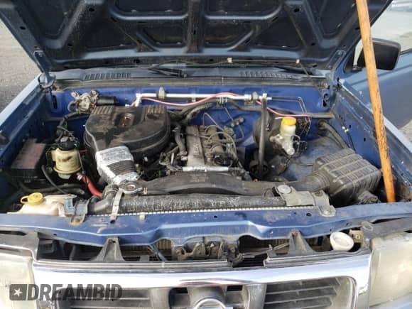 1999 Nissan Frontier XE z VIN 1N6DD26S2XC337625, wystawiony jako Copart lot #45607125 z przebiegiem 312 502 mil mil oraz Nie do naprawy • Non repairable. Historia ofert i sprzedaży dostępna na DreamBid. Obrazek 11.