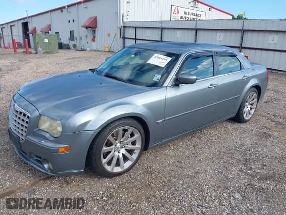 2006 Chrysler 300 C SRT-8 with VIN 2C3LA73W66H523504, listed as a IAAI auction lot 42483103 with 61,560 mi miles and . Bid and sale history available at DreamBid. Image 2.
