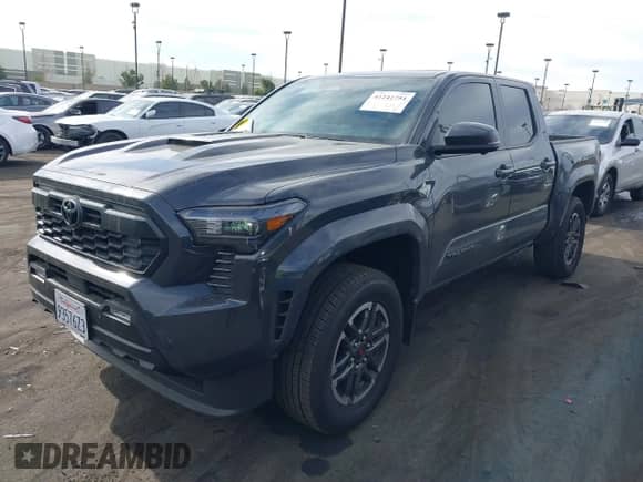2024 Toyota Tacoma SR5 with VIN 3TMLB5JN5RM051339, listed as a IAAI auction lot 41241754 with 7,181 mi miles and . Bid and sale history available at DreamBid. Image 18.