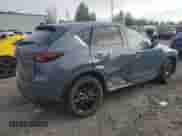 2025 Mazda CX-5 S Carbon Edition z VIN JM3KFBCM6S0695578, wystawiony jako Copart lot #85923705 z przebiegiem 7 145 mil mil oraz Szkoda całkowita • Salvage title. Historia ofert i sprzedaży dostępna na DreamBid. Obrazek 3.