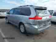 2011 Toyota Sienna XLE with VIN 5TDYK3DC7BS006817, listed as a IAAI auction lot 43410453 with 151,210 mi miles and . Bid and sale history available at DreamBid. Image 3.