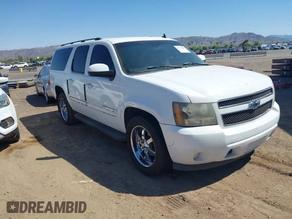 2007 Chevrolet Suburban LTZ z VIN 3GNFC16J57G113284, wystawiony jako IAAI lot #42477695 z przebiegiem Nie podano mil oraz . Historia ofert i sprzedaży dostępna na DreamBid. Obrazek 1.