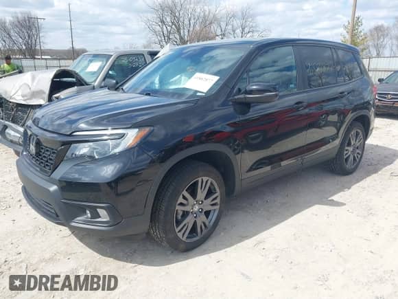 2021 Honda Passport EX-L with VIN 5FNYF8H51MB024220, listed as a IAAI auction lot 41882877 with 53,212 mi miles and . Bid and sale history available at DreamBid. Image 2.