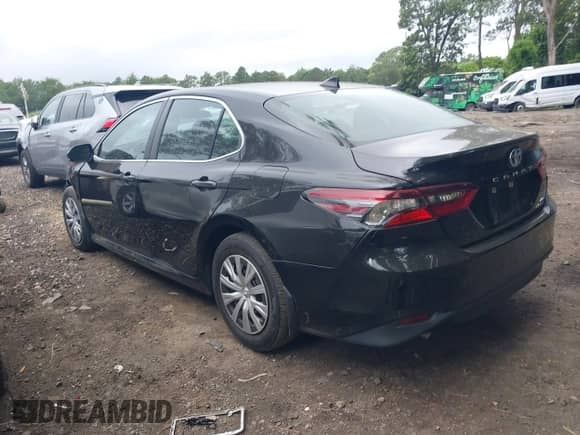 2022 Toyota Camry Hybrid LE with VIN 4T1C31AK3NU570645, listed as a IAAI auction lot 42659916 with 19,420 mi miles and . Bid and sale history available at DreamBid. Image 14.