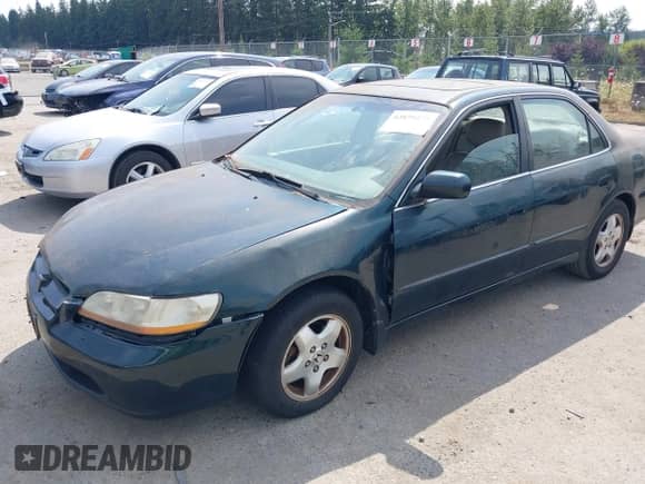 1998 Honda Accord EX z VIN 1HGCG1657WA041067, wystawiony jako IAAI lot #42879572 z przebiegiem Nie podano mil oraz . Historia ofert i sprzedaży dostępna na DreamBid. Obrazek 13.