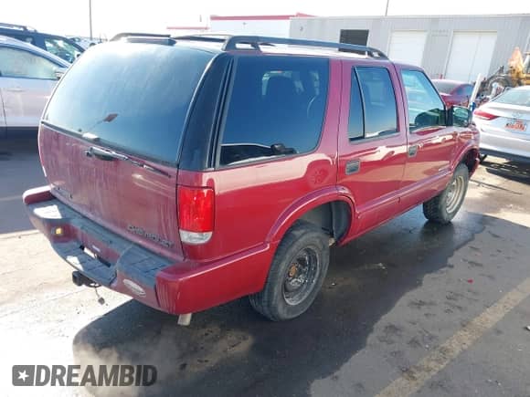 2002 Chevrolet Blazer LS z VIN 1GNCS13WX2K197447, wystawiony jako IAAI lot #41336365 z przebiegiem 196 555 mil mil oraz . Historia ofert i sprzedaży dostępna na DreamBid. Obrazek 4.