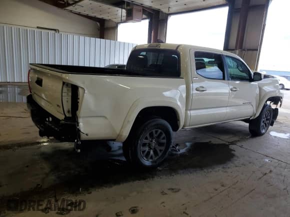 2023 Toyota Tacoma SR with VIN 3TMCZ5AN8PM534476, listed as a Copart auction lot 85723175 with 50,964 mi miles and Salvage title. Bid and sale history available at DreamBid. Image 3.