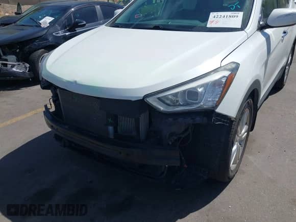 2014 Hyundai Santa Fe z VIN 5XYZWDLA8EG140946, wystawiony jako IAAI lot #42241809 z przebiegiem 137 584 mil mil oraz . Historia ofert i sprzedaży dostępna na DreamBid. Obrazek 6.