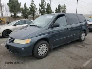 2004 Honda Odyssey LX with VIN 5FNRL18574B137609, listed as a Copart auction lot 68292805 with 172,873 mi miles and Salvage title. Bid and sale history available at DreamBid. Image 1.