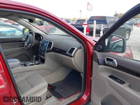 2012 Jeep Grand Cherokee Laredo with VIN 1C4RJFAGXCC256023, listed as a IAAI auction lot 43587897 with 199,803 mi miles and . Bid and sale history available at DreamBid. Image 5.