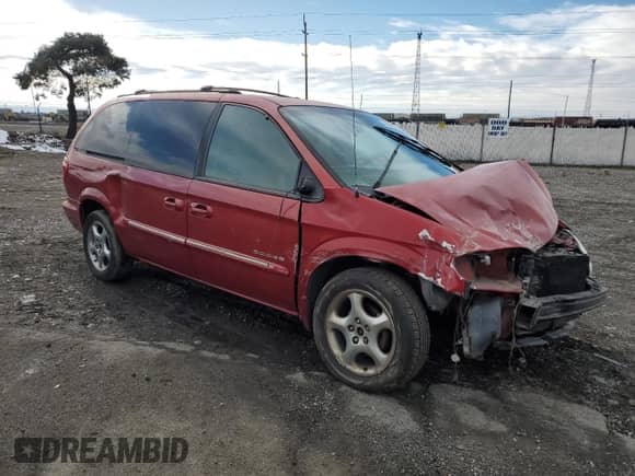 2001 Dodge Caravan ES with VIN 2B8GP54L31R220067, listed as a Copart auction lot 43602265 with 209,684 mi miles and Salvage title. Bid and sale history available at DreamBid. Image 4.