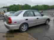 2002 Hyundai Accent GL z VIN KMHCG45C12U355561, wystawiony jako Copart lot #54546945 z przebiegiem 22 893 mil mil oraz Szkoda całkowita • Salvage title. Historia ofert i sprzedaży dostępna na DreamBid. Obrazek 3.