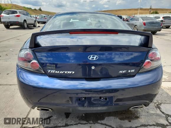 2008 Hyundai Tiburon GT с VIN KMHHN66F78U288604, выставлен на аукционе Copart как лот 70559655 с пробегом 92 082 миль миль и Списание • Salvage title. История ставок и продаж доступна на DreamBid. Изображение 6.