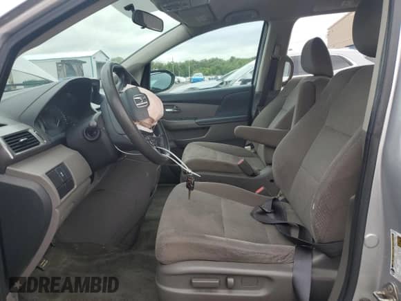 2015 Honda Odyssey LX with VIN 5FNRL5H25FB010843, listed as a Copart auction lot 69916285 with 115,544 mi miles and Salvage title. Bid and sale history available at DreamBid. Image 7.