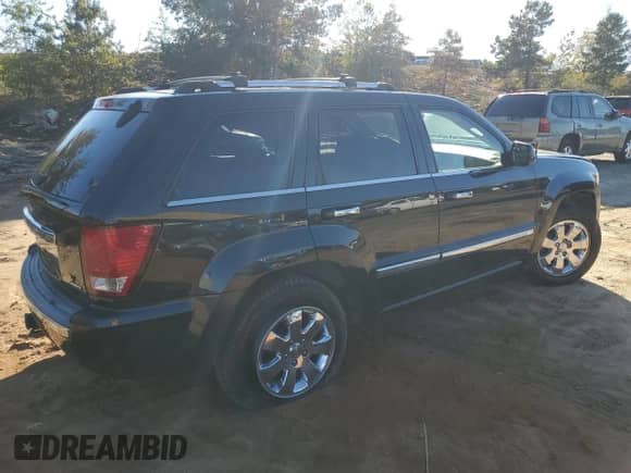 2009 Jeep Grand Cherokee with VIN 1J8HR68T19C550936, listed as a Copart auction lot 80090724 with 113,543 mi miles and Salvage title. Bid and sale history available at DreamBid. Image 3.
