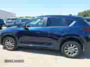 2025 Mazda CX-5 S Select z VIN JM3KFBBL3S0677855, wystawiony jako IAAI lot #43183580 z przebiegiem 6 185 mil mil oraz . Historia ofert i sprzedaży dostępna na DreamBid. Obrazek 14.