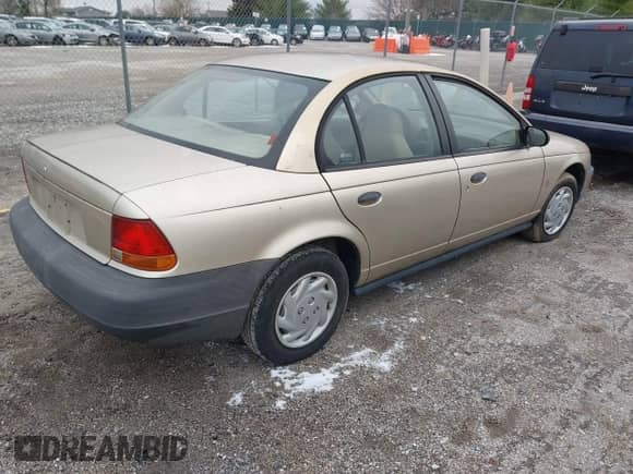 1997 Saturn SL с VIN 1G8ZF5287VZ404576, выставлен на аукционе IAAI как лот 40960689 с пробегом 119 806 миль миль и . История ставок и продаж доступна на DreamBid. Изображение 4.
