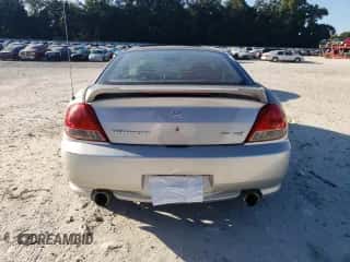 2005 Hyundai Tiburon GT с VIN KMHHN65F75U157864, выставлен на аукционе Copart как лот 75385814 с пробегом 198 670 миль миль и Списание • Salvage title. История ставок и продаж доступна на DreamBid. Изображение 6.